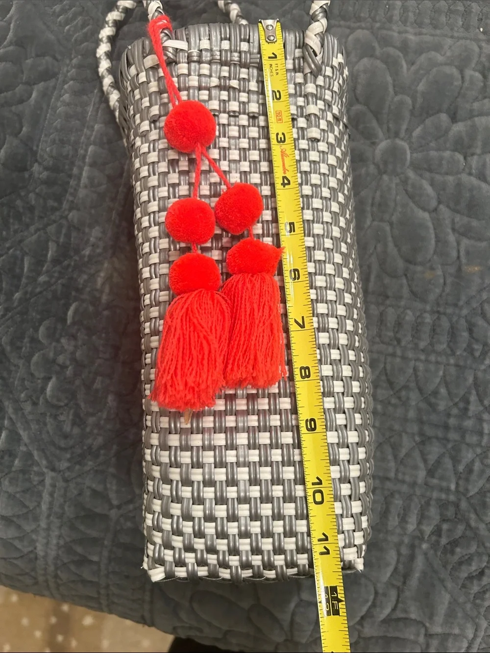 Woven Gray Tote Bag with Red Tassel Accent